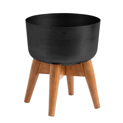 Coyo – Übertopf mit gedrechseltem Messing-Holzbein, Schwarz (verschiedene Größen)