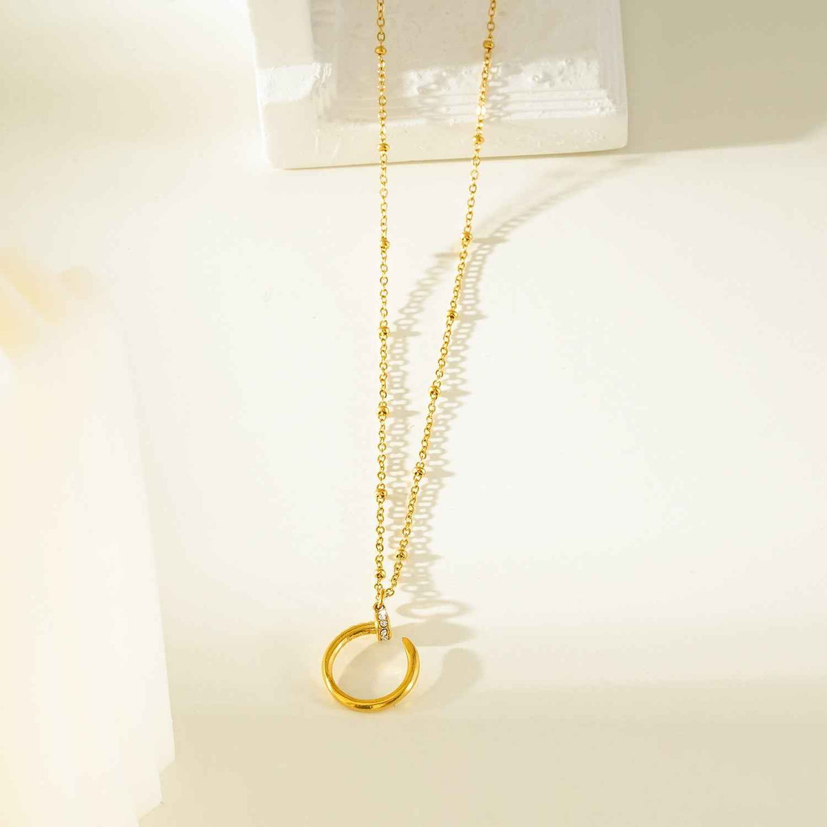 CSENGE Gold Necklace:  Zirconia Embedded Circular Nail Pendant on a Satellite Beaded Chain